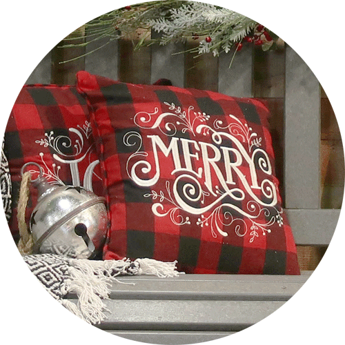 Red plaid pillows that say Joy and Merry.